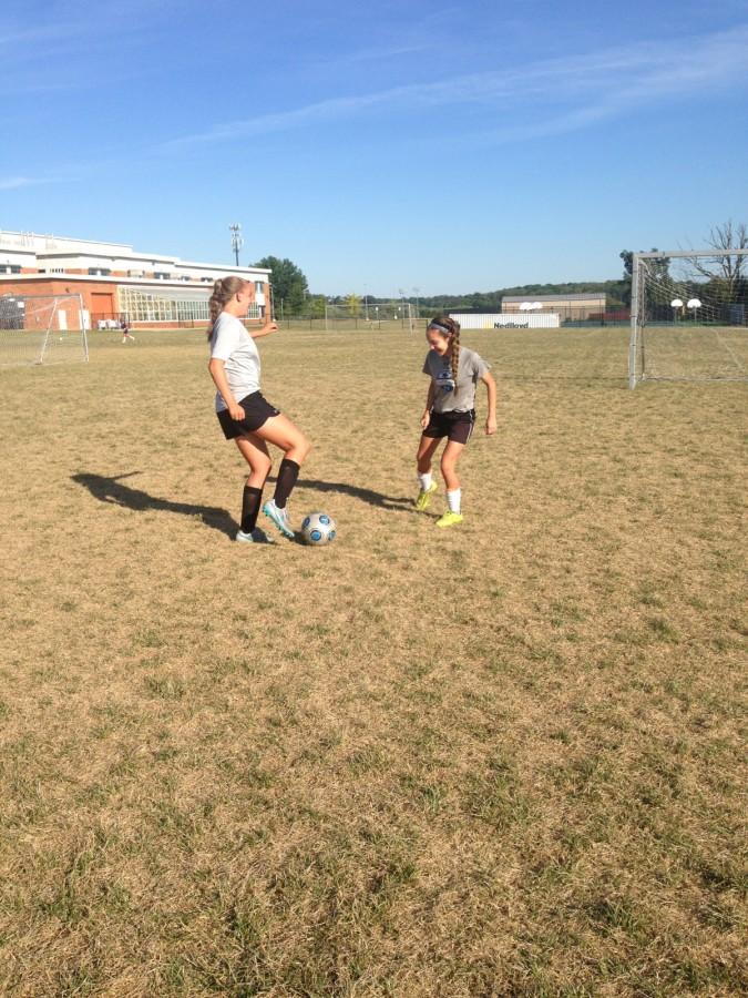 Olivia Weinel (left) and Marie Tapscott (right) work on their 1v1 skills.