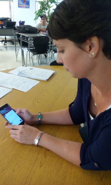 Laura Scuffins uses the Google Classroom app to make an assignment.