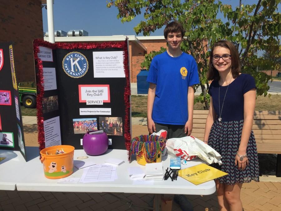 Sydney Rossman (Vice President) and Dan Moore (Secretary) of the Key Club, are welcoming new members at the Club Fair