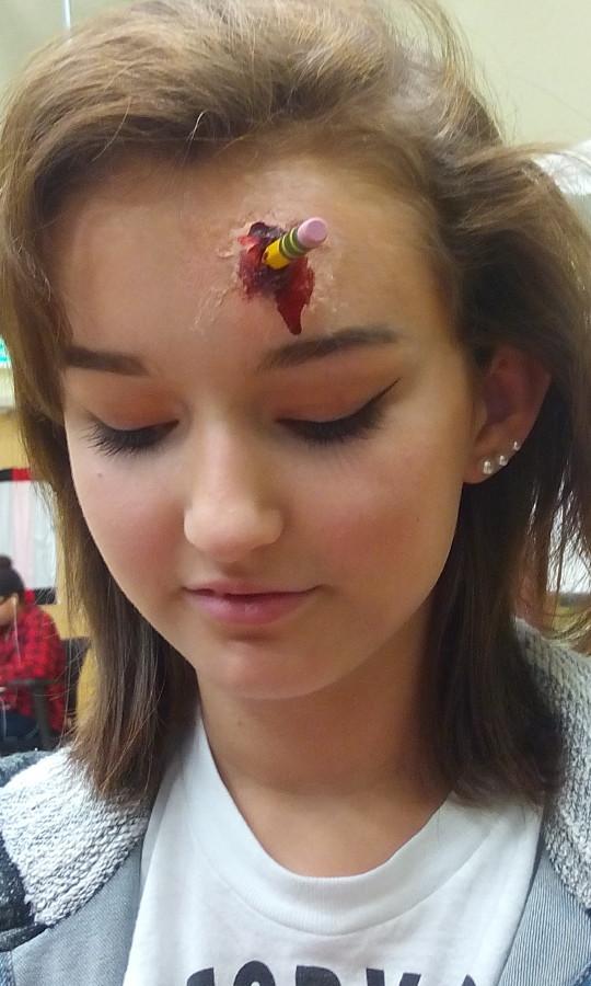 Fake impalement on Lauren Halls head.