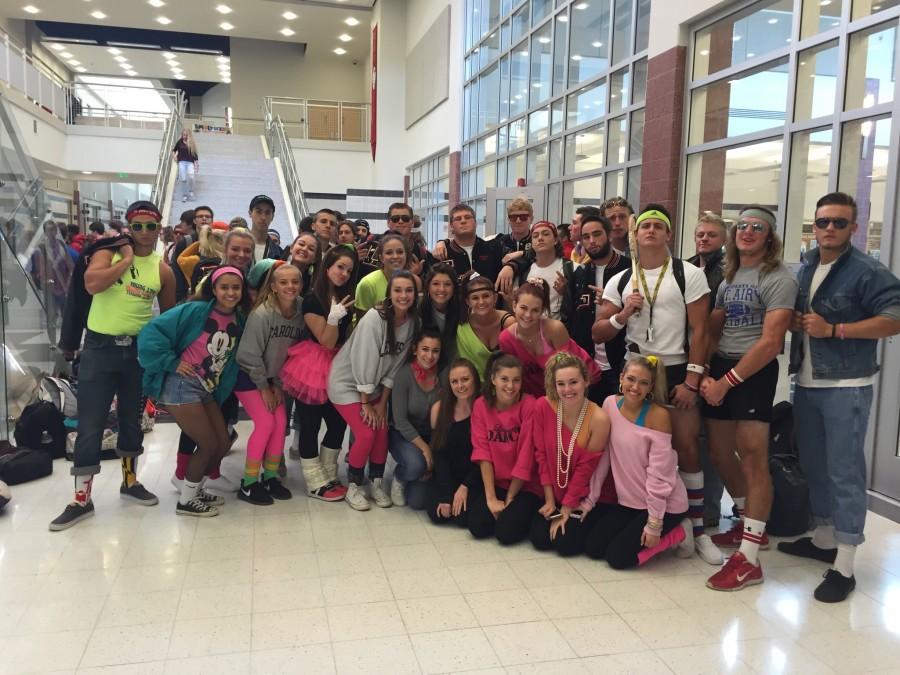 The senior class dresses up in 80s garb.