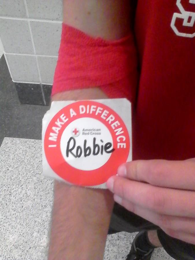 Junior, Robbie Miley,  got a sticker for donating blood.