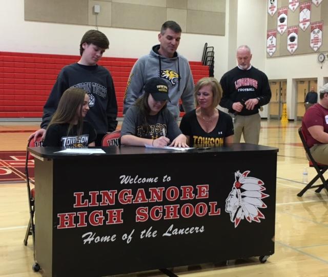 Elizabeth Coletti and family sport Towson gear as Coletti signs her letter of intent. 
