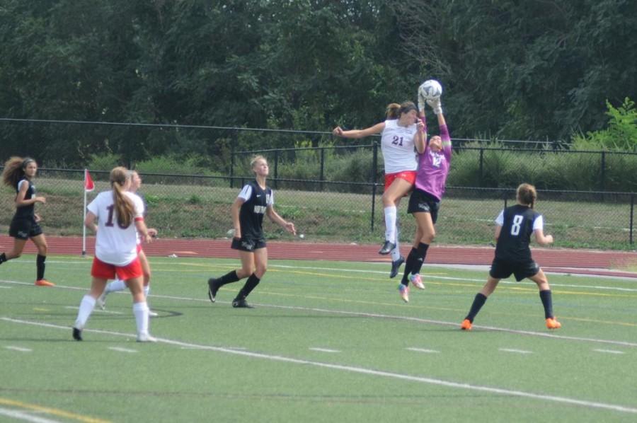 Montanna Hill goes up against Northwest's goalie in an attempt to put one away for Linganore. 