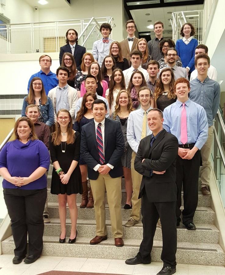 New inductees, society advisers, and Rho Kappa officers pose for a group photo after the annual induction ceremony.