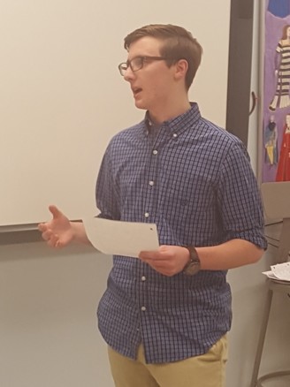 Junior Brendan McCann argues against the statement cheating death is justified in the World Scholars teams final debate before a weekend competition.