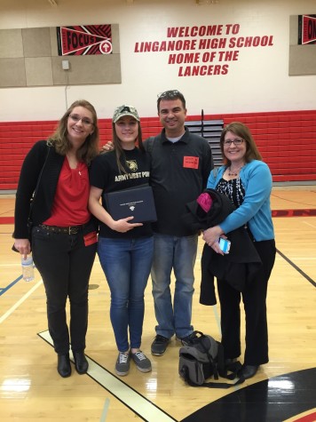 Emma Roerty with her family after signing to West Point.
