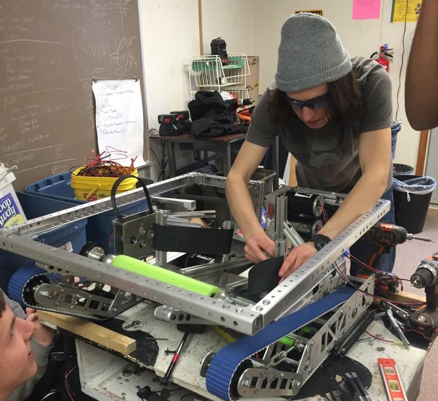Junior Nate Vanhoozer works on the final framework for the robot.