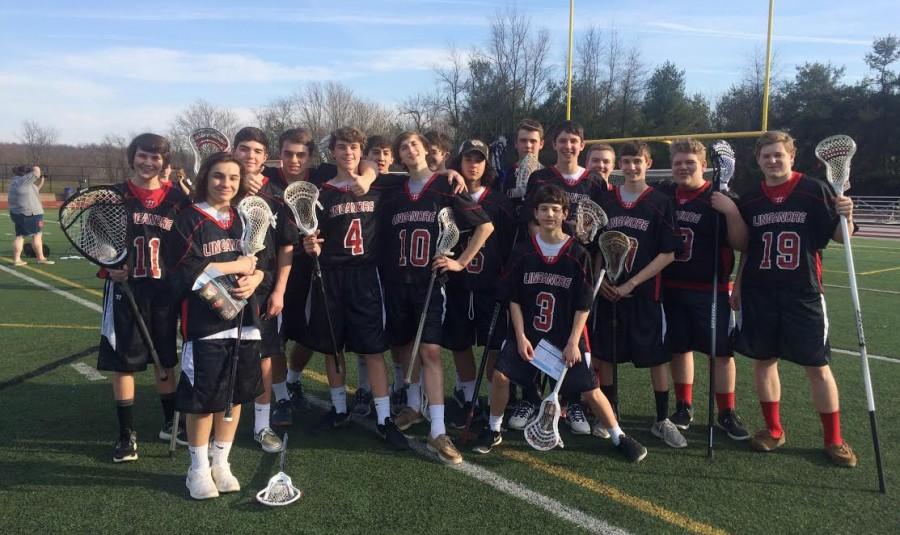 The+boys+JV+lacrosse+team+poses+for+a+team+picture.