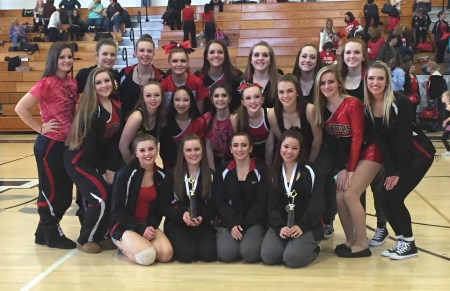 The+LHS+Pom+and+Dance+team+poses+after+a+successful+first+competition+at+Urbana+High+School.