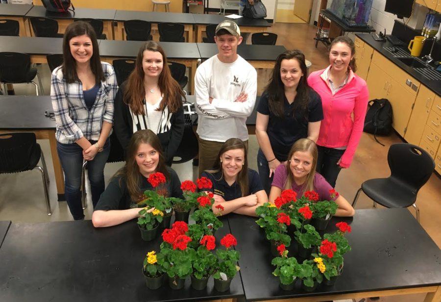 (top left to right) seniors Ashley Abuelhawa, Kaycee Oland, Casey Thompson, Kasey Carns, Delaney Wagner (bottom left to right) Alyssa Mattison, Sabrina Moxely, and Megan Brown celebrate 25 days with flowers.