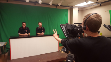 (left to right) Seniors Brennan Henyon, Brennan Nolan, Shawn Hanan get ready to record their second-to-last session of the morning announcements.