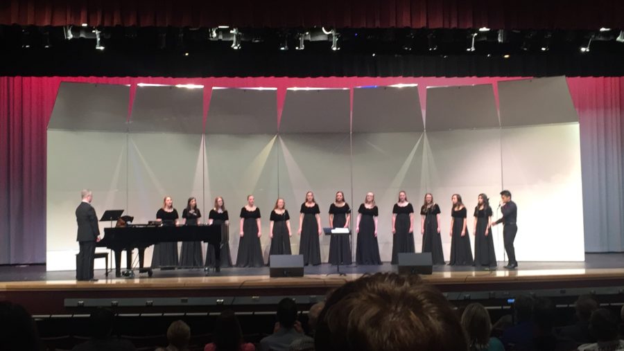 Dye and vocal ensemble members (left to right) Megan Wilhelm, Deanna Parenti, Paige Marley, Abbie Weinel, Michelle Gass, Cassia Connolly, Karly Johnson, Vanessa Warren, Grace Yingling, Madeline Wodaski, Martha Madrid, and Gabriela Coca Leon are joined by Andrew Livioco in their performance of Royals by Lorde.