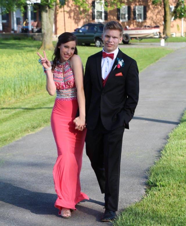 Juniors Grace Weaver (right) and Brandon Cooper (left) walk down Shelby Iagers driveway