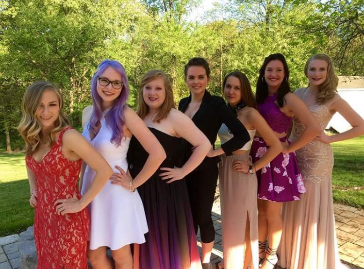 Senior Mary Jane Foster, Urbana High School senior Nicole Benner, seniors MacKenzie Wilson, Sarah Carpenter, Leigh Rankin, South Carolina ACT senior Anna Carpenter, and senior Cassie Wheels smile for the camera before prom.