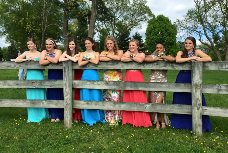 From left to right Juniors Gabriella Wolfe, Lauryn Lovewell, Claire Coupard, Olivia Wolfe, Erika Kosar, Shylo Arneson, Kennedi Ambush, and Paige Badostain pose at Shylos farm