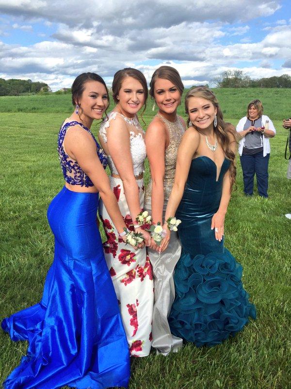 (Left to right) Seniors Elizabeth Coletti, Elena Guardia, Kayla Sheehy, and Brianna Fay show off their corsages.