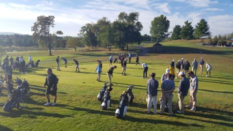 Golfers prepare for the tournament to begin.