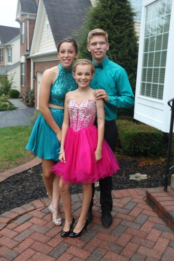 Editor Grace Weaver poses with Lily Weaver and Brandon Cooper before the homecoming dance.