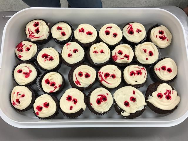 Blood-drip cupcakes with vampire bite marks.