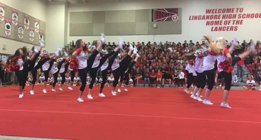 The pom and dance team performs at the pep rally.