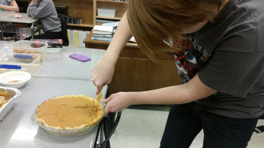 Beau Cameron slices up some pumpkin pie for the taste test. 