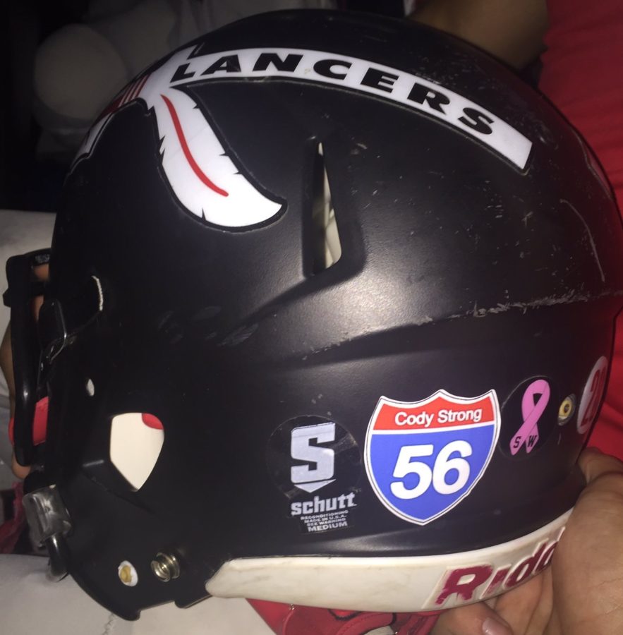 The Varsity Football helmets featured a sticker in support of Cody Huber.  