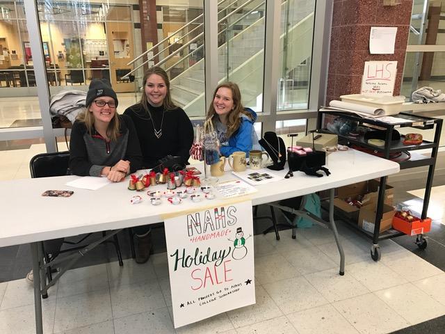 National Art Honor Society officers sell handmade pieces. 