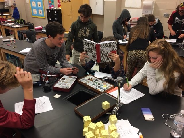 Billy Higgins and Lauren Ryan work on mineral identification.  Max Ross and Juliana Zeller participate with their groups.