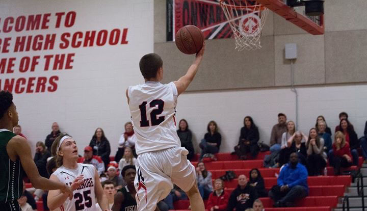 Nick Lang takes a lay up for the Lancers. 