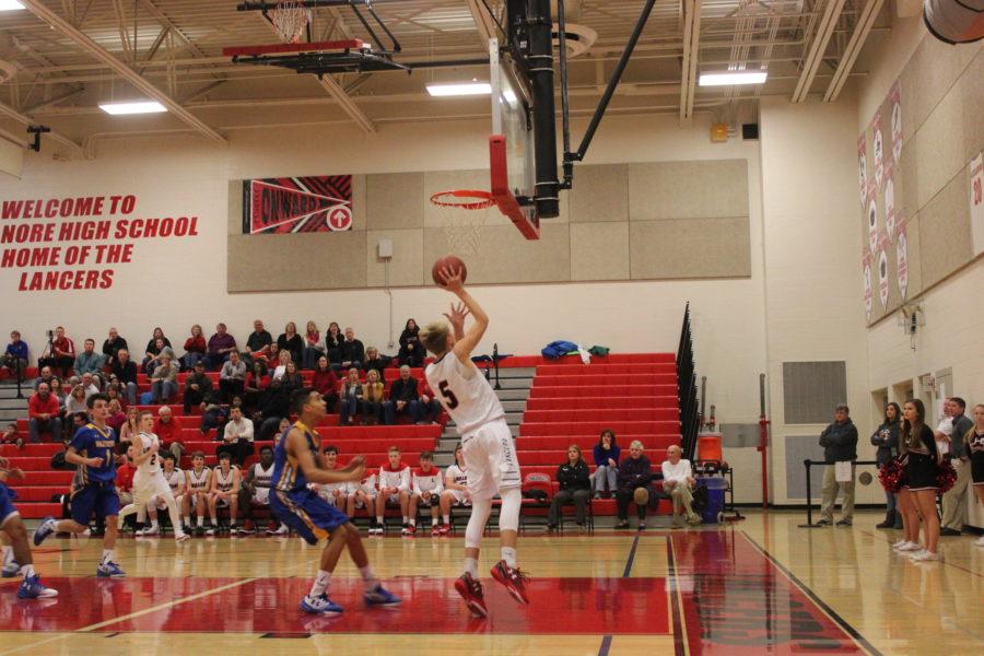 Sophomore Christian Nolan aims for a basket.