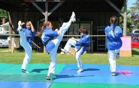 Hanna Dufresne (second one from the left) performs with her Tae Kwon Do demo team.