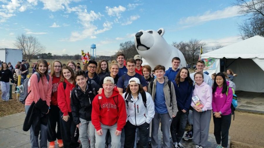 Brave Lancers pose with the polar bear before they plunge.