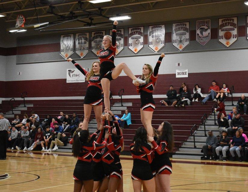 Alyssa Chappell (top middle) cheering at one of the basketball games.