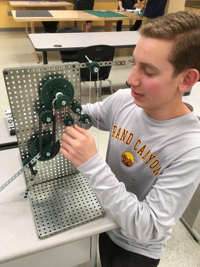 Evan Connelly works on compound simple machine in POE