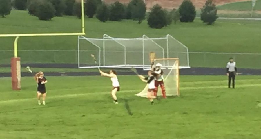 Emily Cole takes on Brunswick player during the game. 