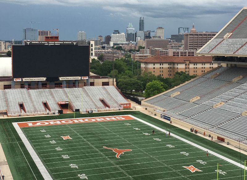University of Texas - Austin stadium with Downtown Austin skyline behind it