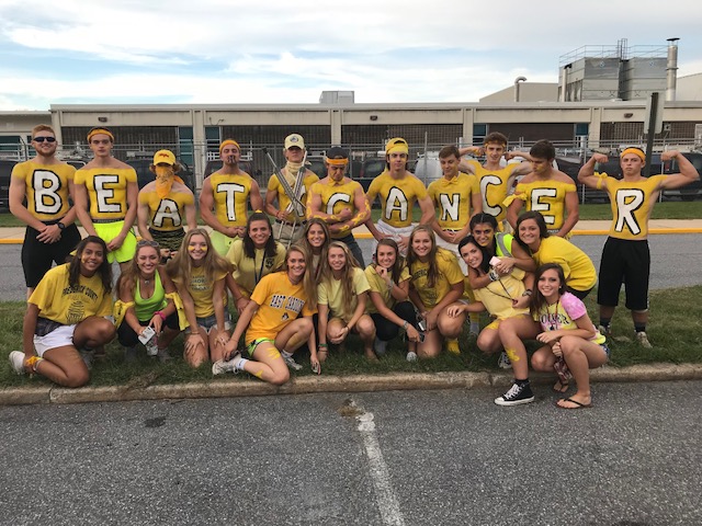 Tribe and Lady Tribe at away game vs. Thomas Johnson wearing yellow to support Lily Weaver.
