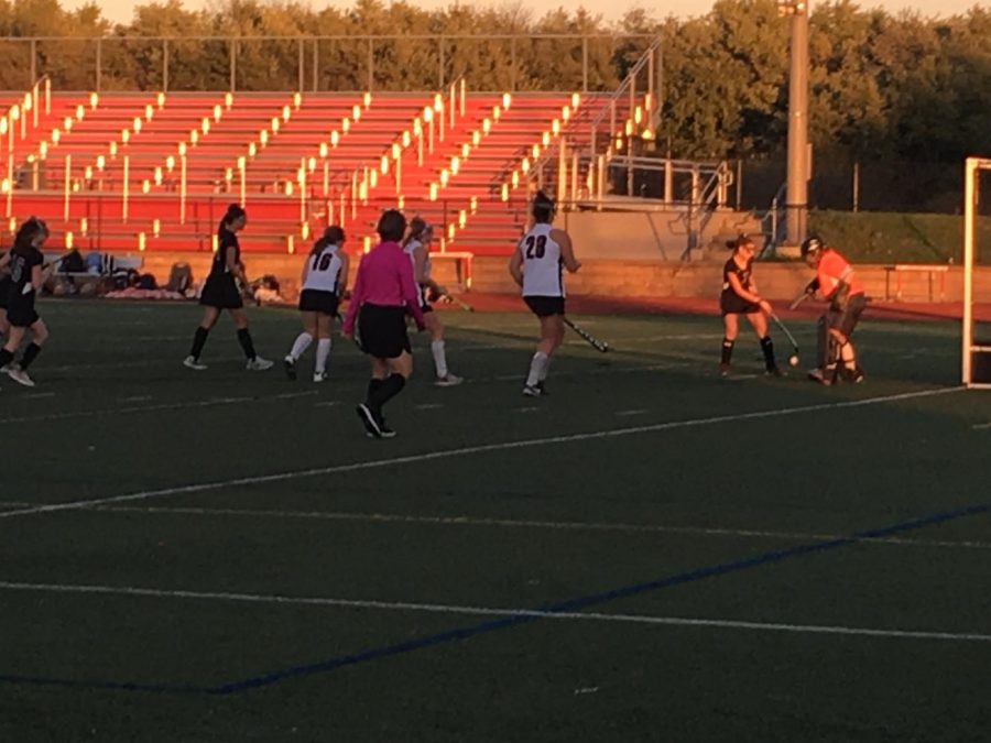 Linganore goalie blocking Winter Mills offense player from scoring 