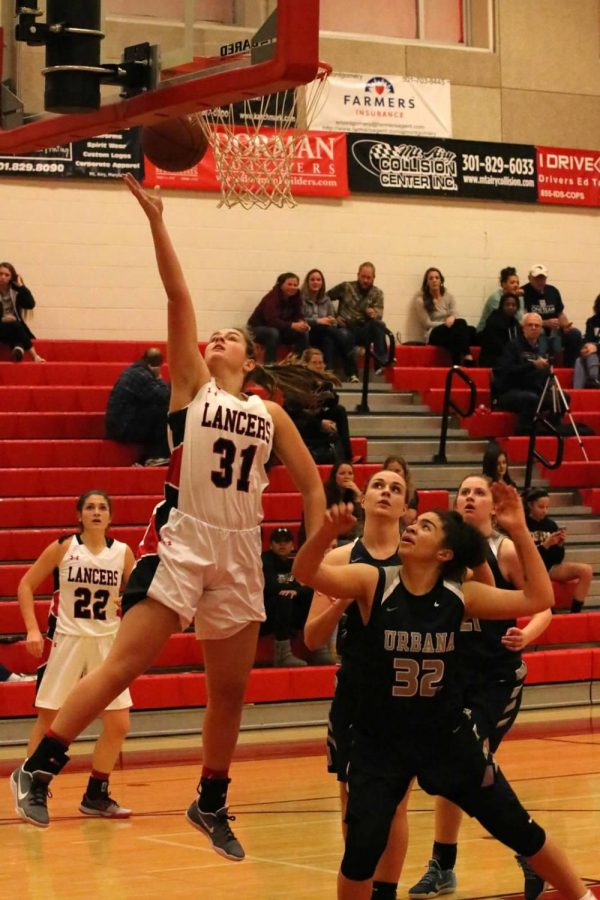 Jessica Mitchell soaring over the Urbana Hawks.
