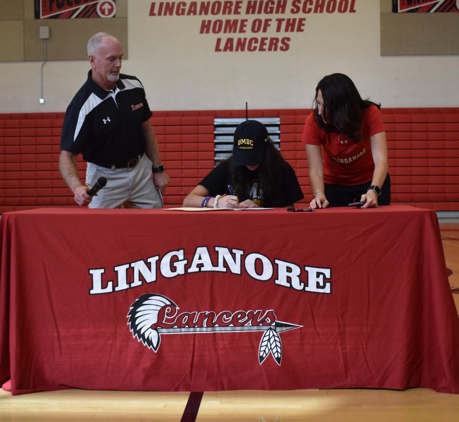Adriana DAmore signs her national letter of intent.