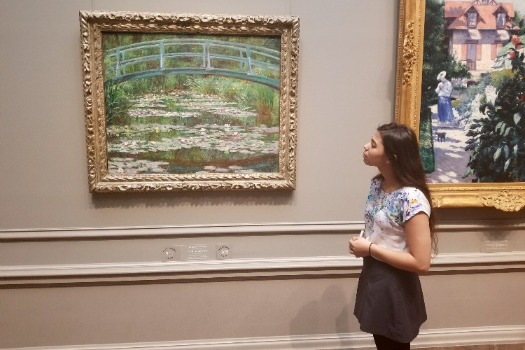 Jillian Kolesar admires Claude Monets famous painting, The Japanese Footbridge.