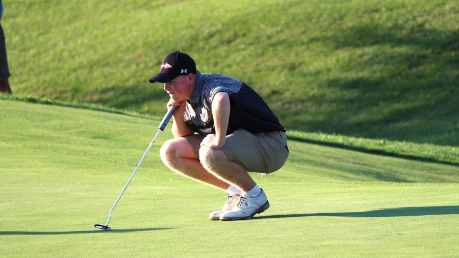Twillman studies the green before he putts.