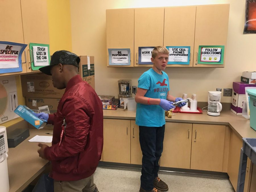 Jalen Davis and Brandon Kline prepare coffee and tea. 