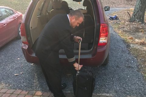 Dennis Player packs the car before leaving for work. 
