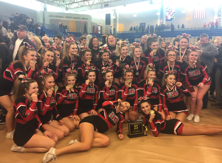 Varsity Cheer celebrating their State win.