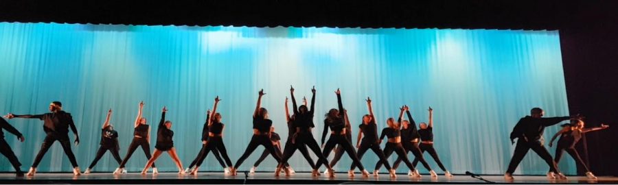 Savage dance company performs a hip hop dance to kick off the recital. 