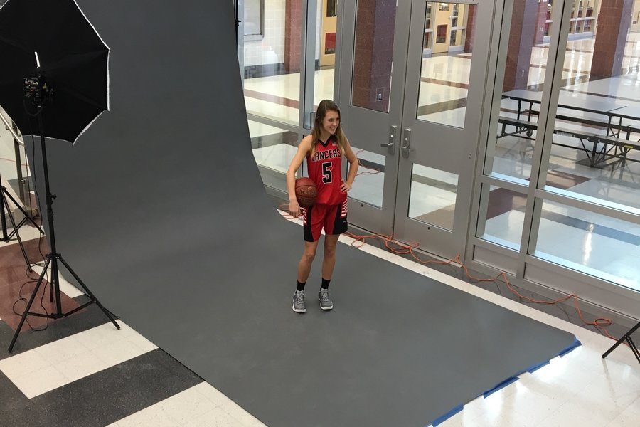 Class of 2019 member and Girls Varsity  Basketball player Shay Arneson gets her athletic pictures taken. 