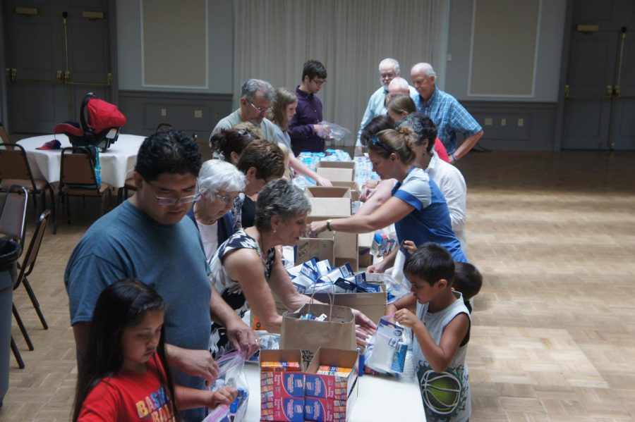 Members at St. Peters assemble Blessings in a Backpack bags.