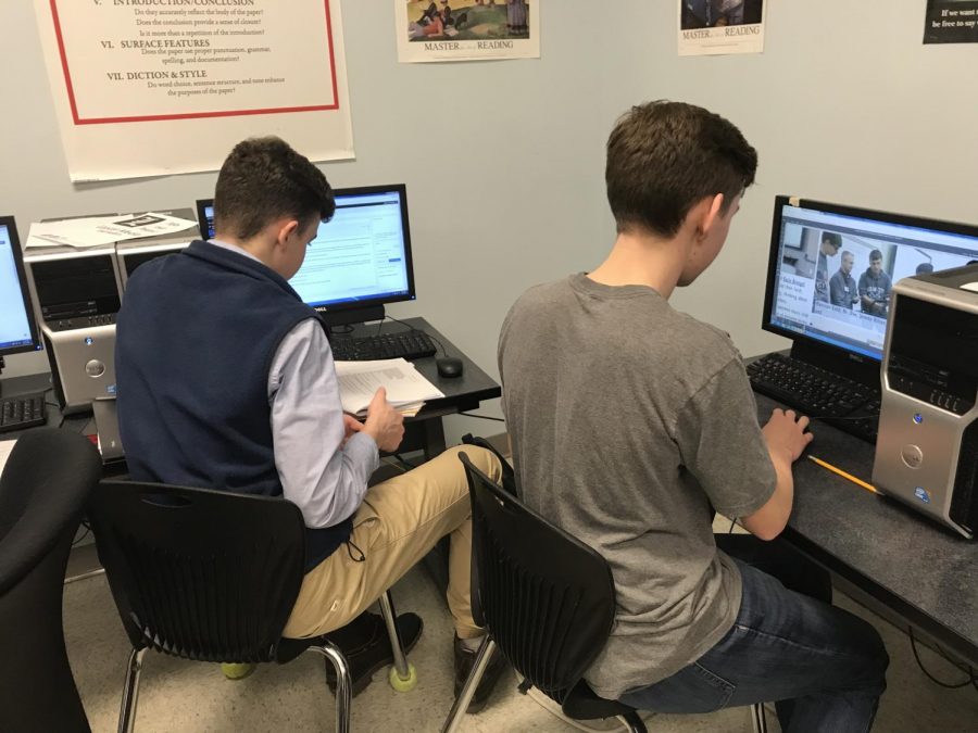 Jacob Bolger and Benjamin Rose hard at work on their story about our schools custodians.